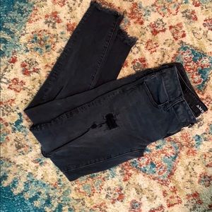 Black. Ripped AE skinny jeans